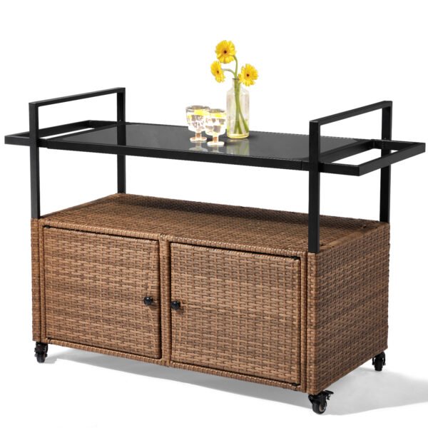 Outdoor wicker bar cart with glass top and wheels in light brown rattan