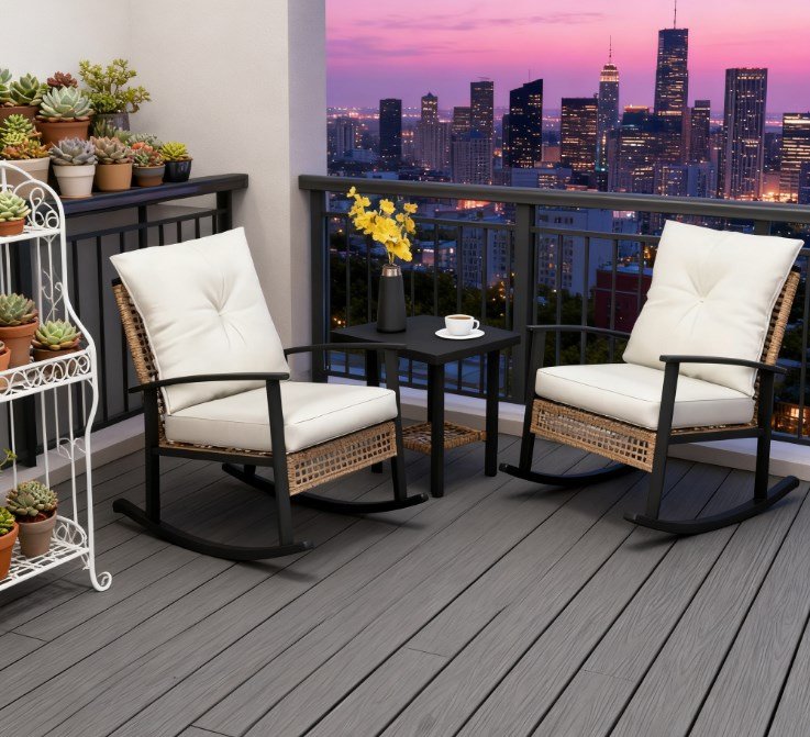 light yellow wicker rocking chair set with white cushions on a city apartment balcony with flowers coffee and evening skyline