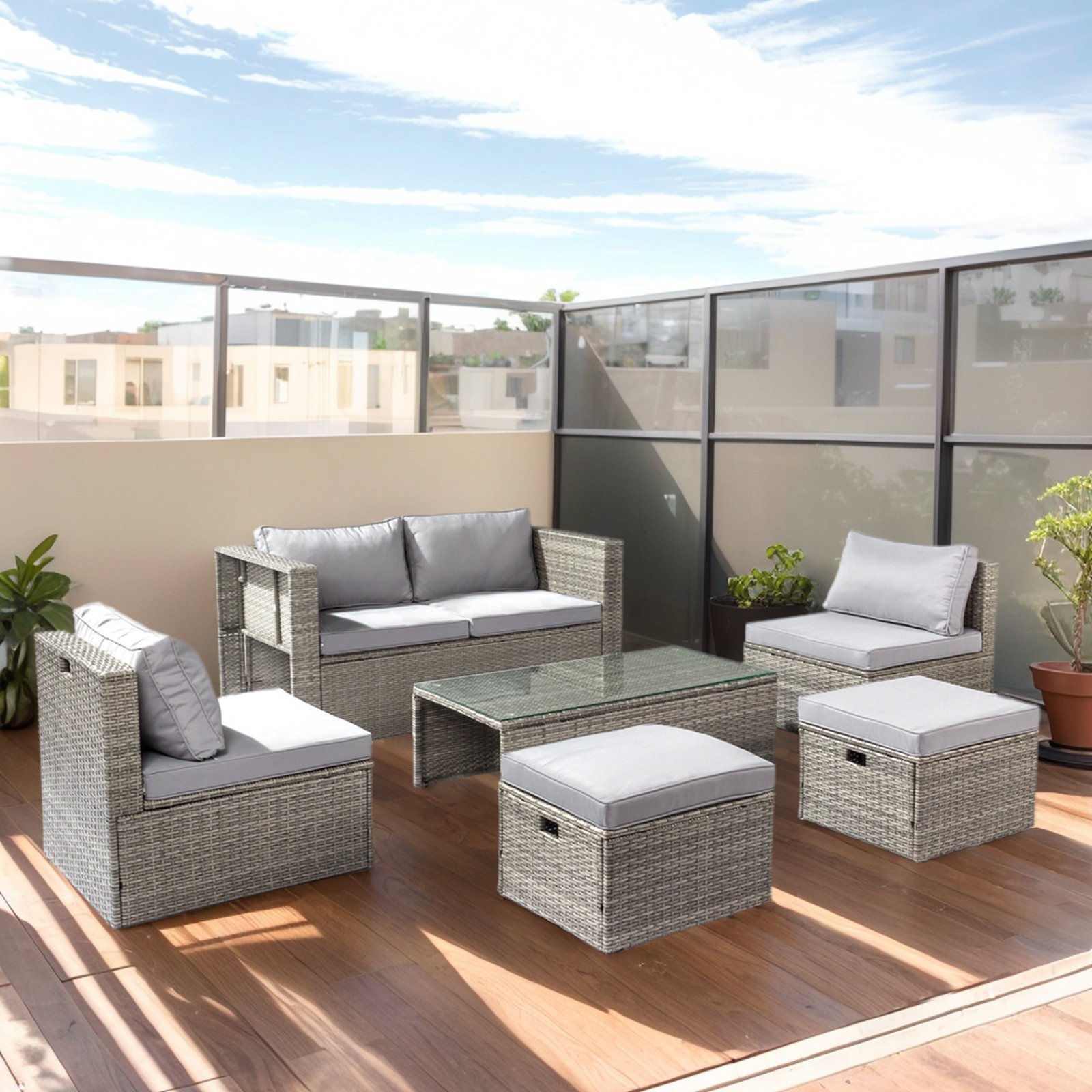 6-piece outdoor wicker sofa set in grey gradient rattan arranged on a sunny rooftop patio