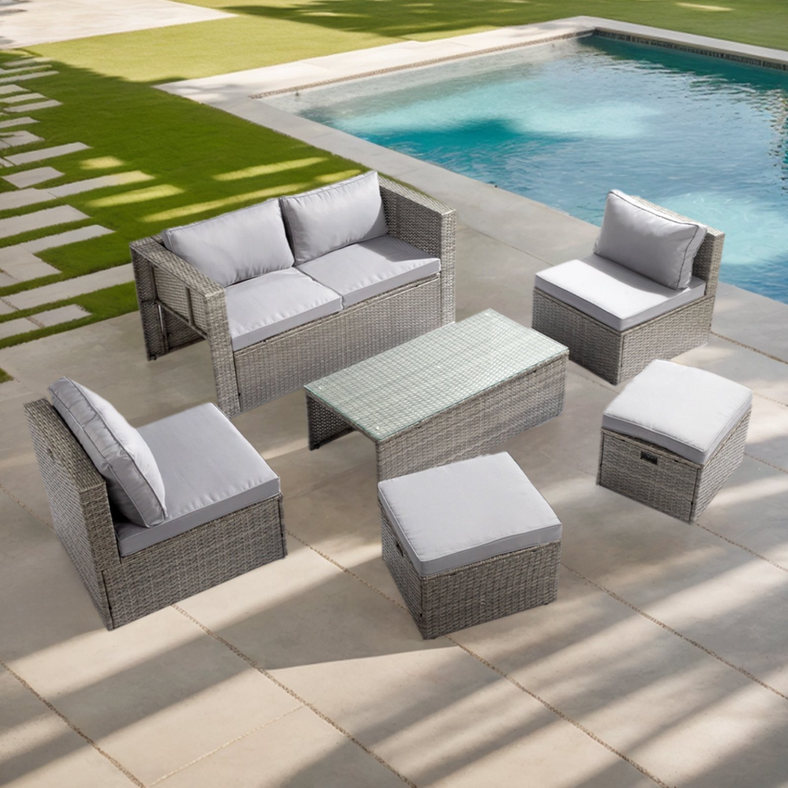 6-piece outdoor wicker sofa set in grey gradient rattan used on a patio by the poolside