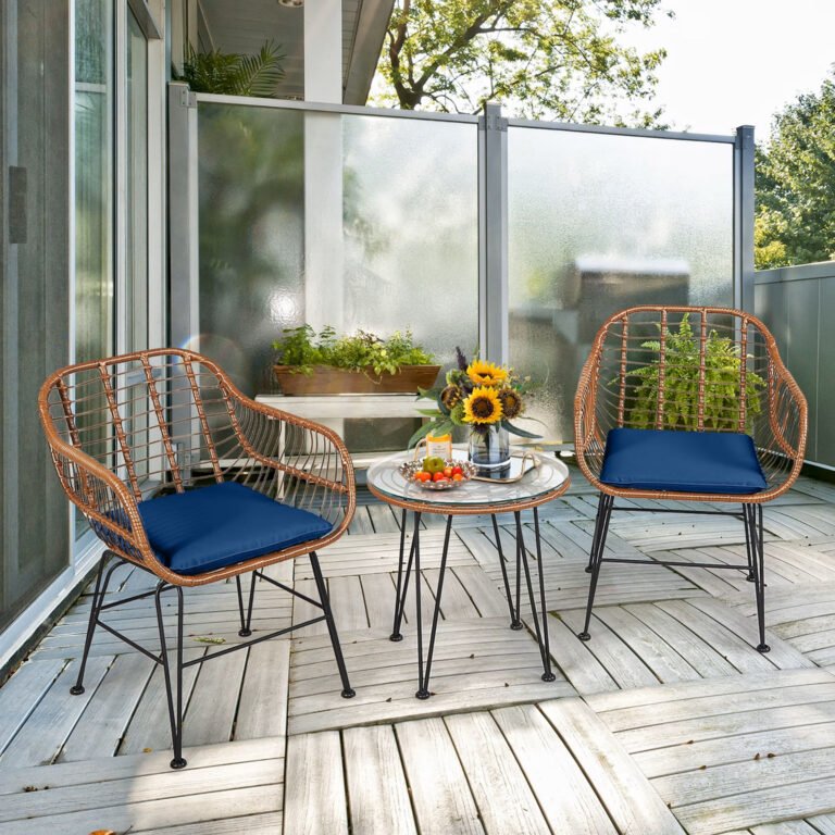 Small apartment balcony with a compact rattan bistro set for two people