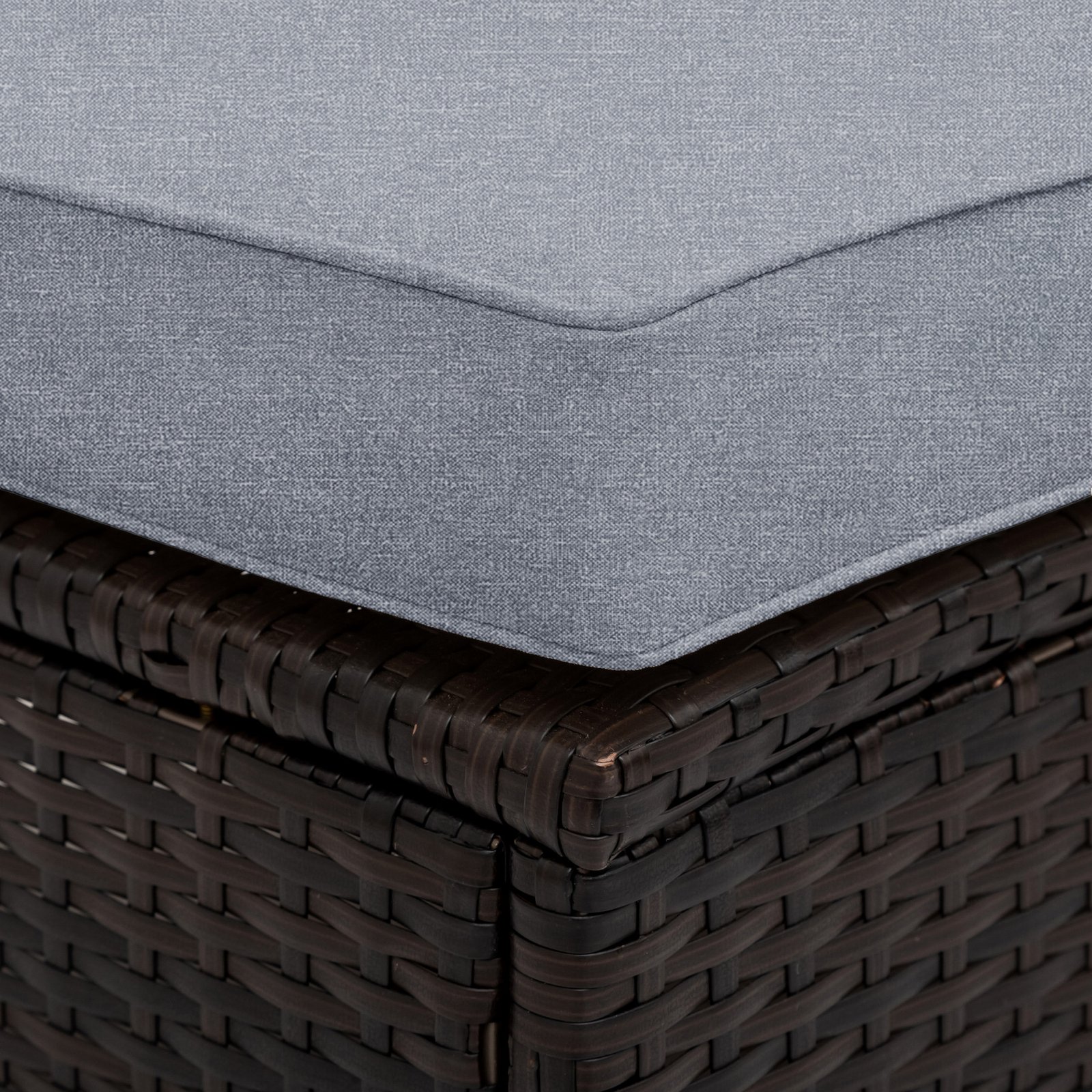 Close-up of wicker corner weaving on table and chairs, along with cushion corner details from 5-piece brown rattan sectional set