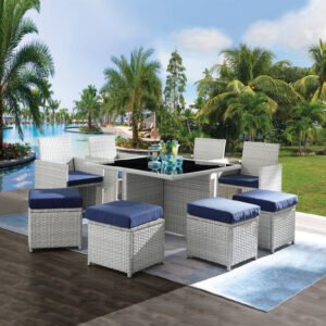 9-piece gray wicker patio dining set with blue cushions on outdoor terrace with drinks on table