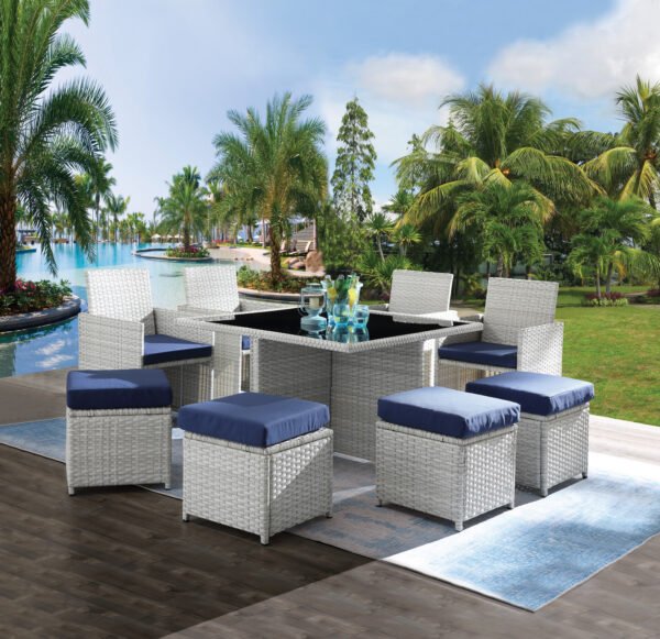 9-piece gray wicker patio dining set with blue cushions on outdoor terrace with drinks on table