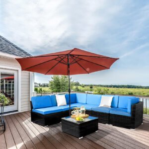 Black wicker patio sectional sofa set arranged in L-shape on outdoor deck under umbrella