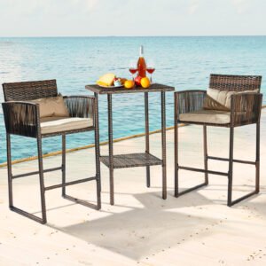 Brown rattan wicker bar set with high-top table styled on a lakeside patio with drinks and snacks