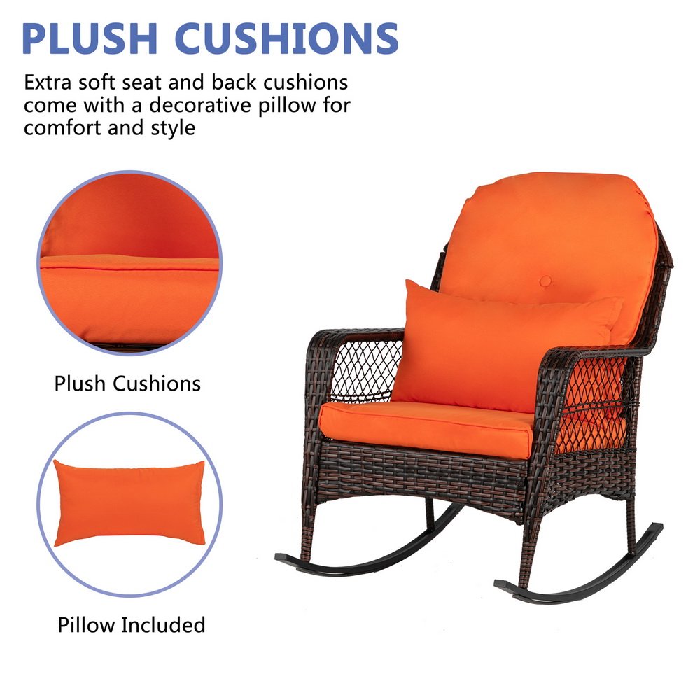 Brown outdoor wicker rocking chair with plush seat and back cushions and decorative pillow