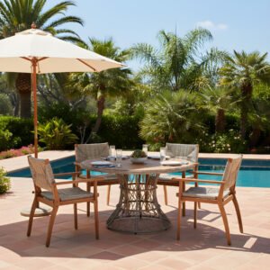 round-acacia-wood-patio-dining-set-poolside Round acacia wood patio dining set with 4 wicker armchairs by the pool under umbrella, table set for four