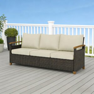 3-seater brown wicker patio sofa with beige cushions placed on an outdoor patio deck