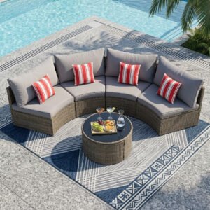 top view of half moon patio furniture set with light gray rattan curved sofas and round table by the pool, with fruit and cocktails