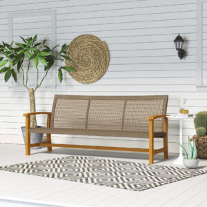 3 seater outdoor wicker patio sofa in teak finish placed on patio against wall with side table and plants