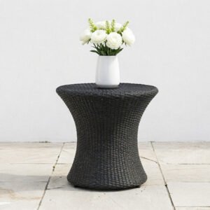 A wide hourglass-shaped wicker outdoor end table in a bold black finish, showcasing its unique tapered silhouette and sturdy woven base.
