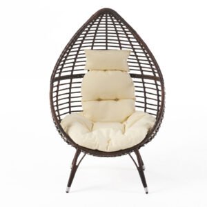 Front view of teardrop lounge chair with cushion, showing freestanding wicker basket design with iron frame on a white background.