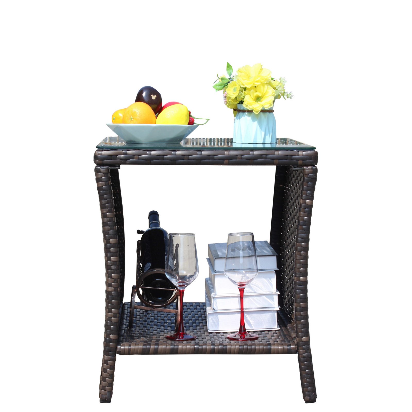 Outdoor wicker conversation set coffee table with flowers, fruit tray, books and wine storage shelf