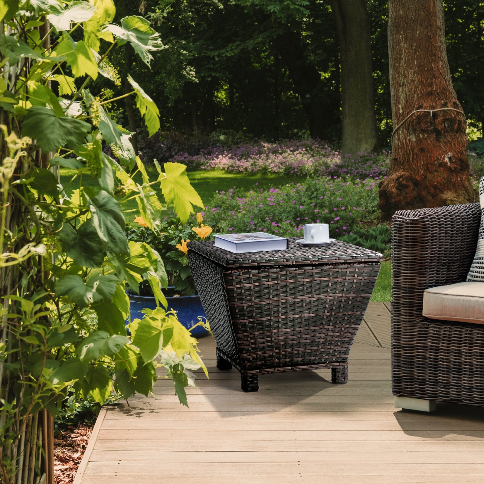 Brown outdoor wicker storage side table placed on a patio beside a matching rattan sofa
