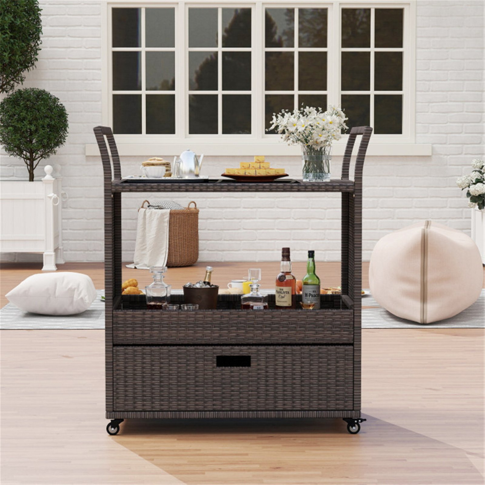 Rattan outdoor bar cart serving drinks and essentials on a patio for outdoor entertaining